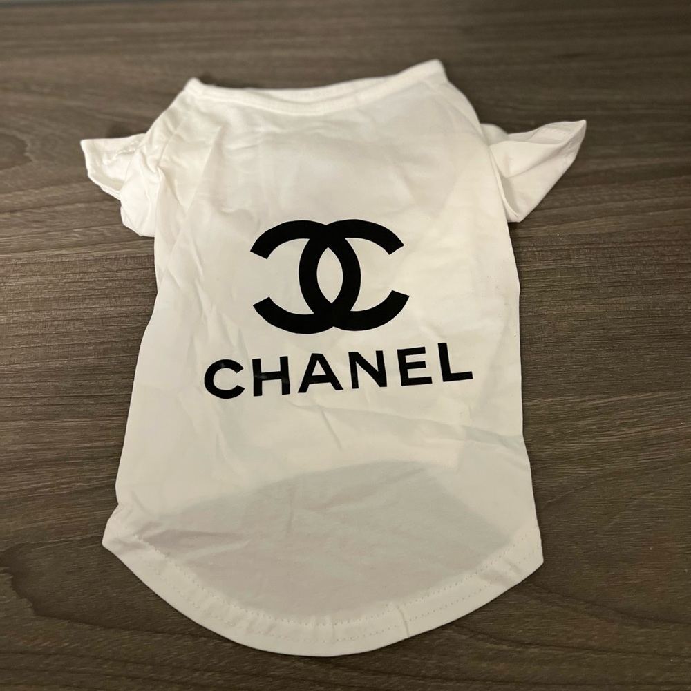 White and black cute  designer dog shirt labeled M but fits as a Small